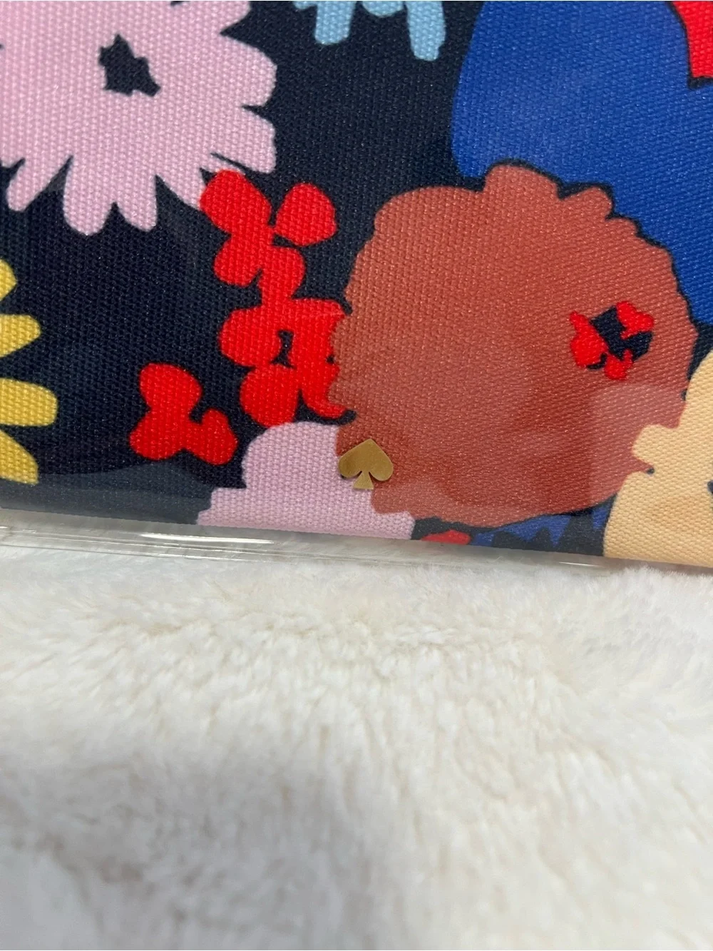 kate spade navy clear floral cosmetic pouch with red and yellow accents